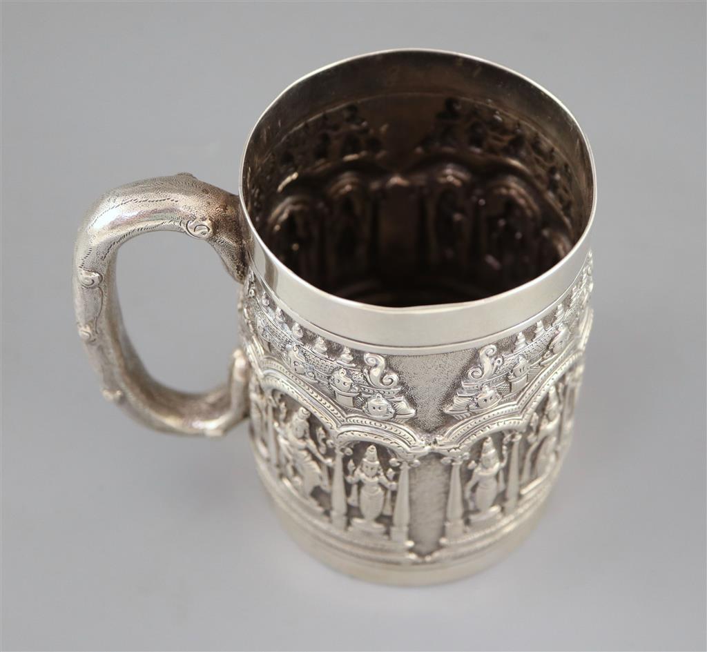 A late 19th century Indian repousse silver mug by P. Orr & Sons, Madras,